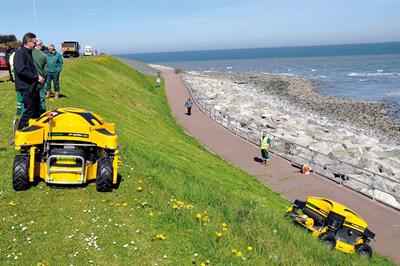 Conwy: two remote-control Spider mowers maintain steep banks along promenades - image: Dvorak